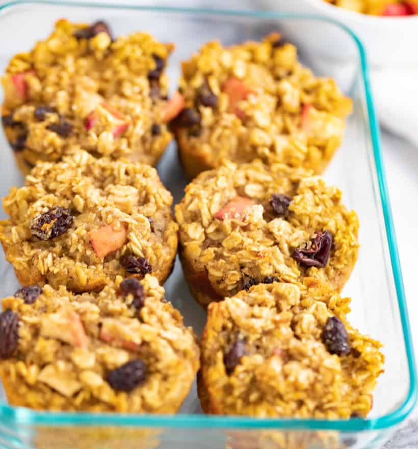 apple oatmeal muffins in a glass storage container