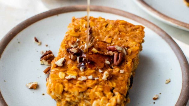 Drizzling syrup on a serving of baked pumpkin oatmeal.