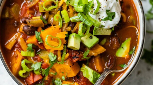 Black bean sweet potato chili topped with sour cream and avocado.