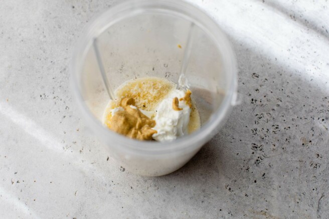 Add Greek yogurt and flavorings to blender.