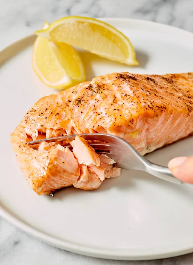 fork cutting into fish