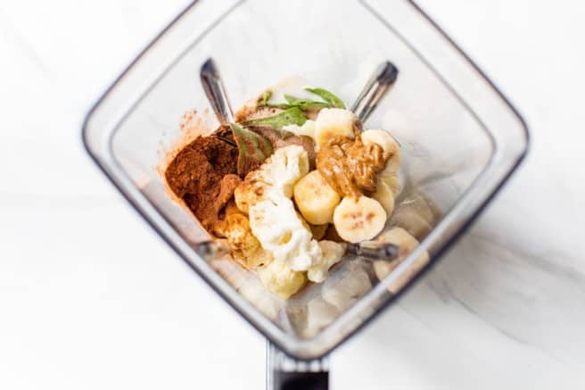 chocolate protein shake ingredients in a blender