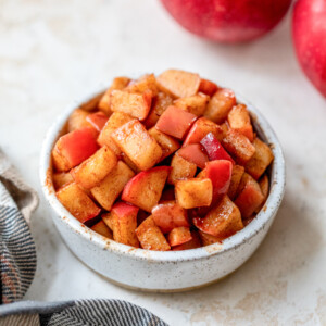 cinnamon apples in a white bowl