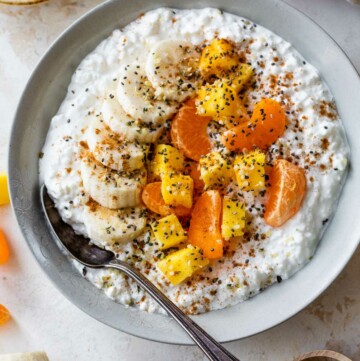 Cottage cheese topped with mango, banana slices, and clementine.