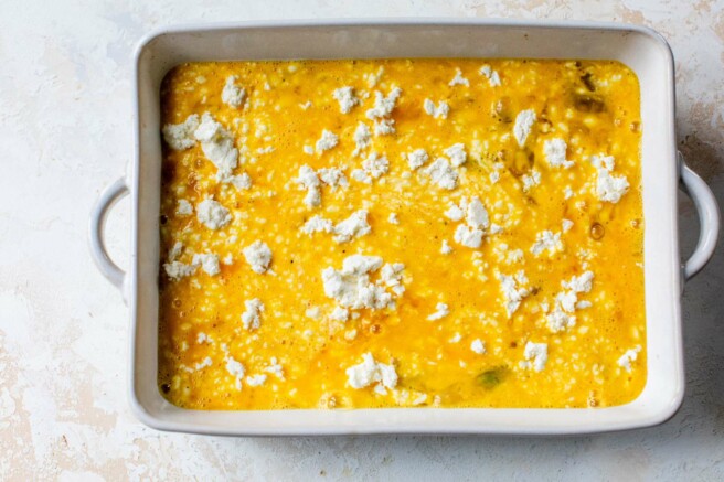 Pour eggs into dish and sprinkle with feta cheese.