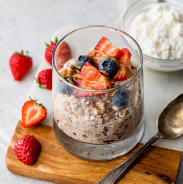 Overnight oats with cottage cheese topped with berries and almond butter.