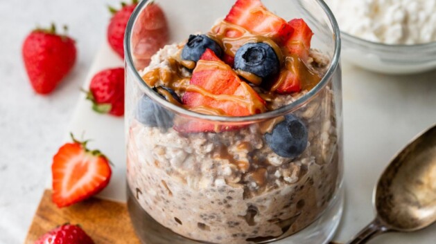 Overnight oats with cottage cheese topped with berries and almond butter.