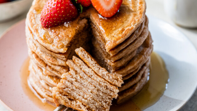 fluffy stack of cottage cheese pancakes with fresh fruit