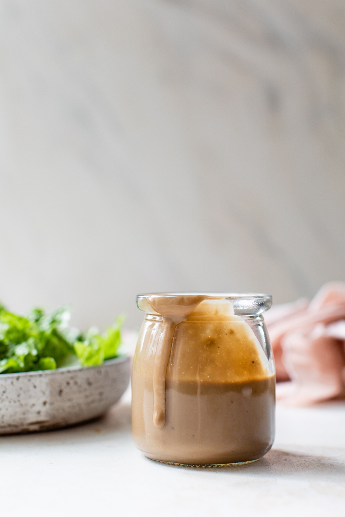 Creamy Balsamic Salad Dressing in a small glass jar