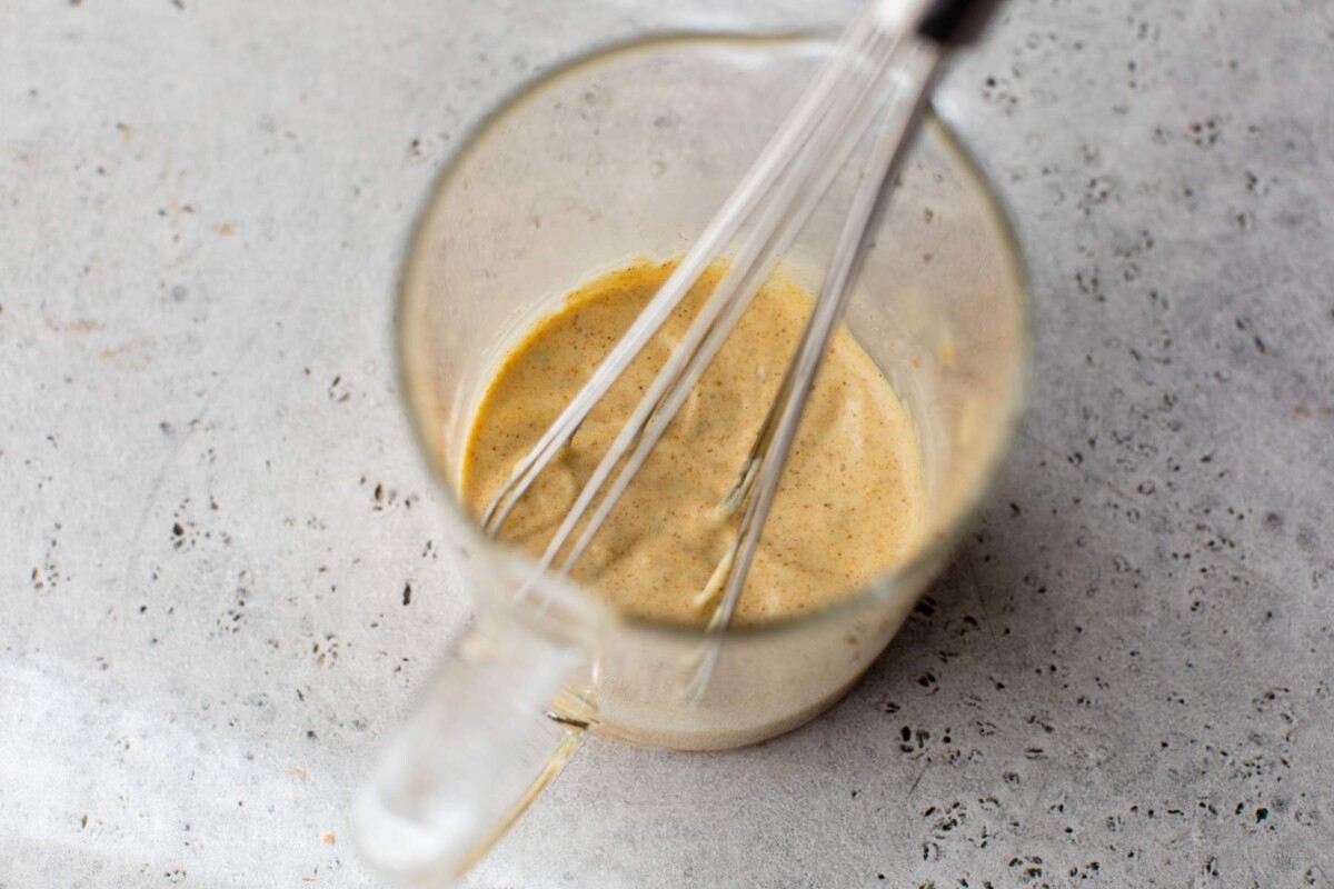 Whisking mayo, Greek yogurt and curry.