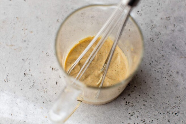 Whisking mayo, Greek yogurt and curry.