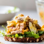 Egg Tuna Salad piled on a slice of bread with lettuce.