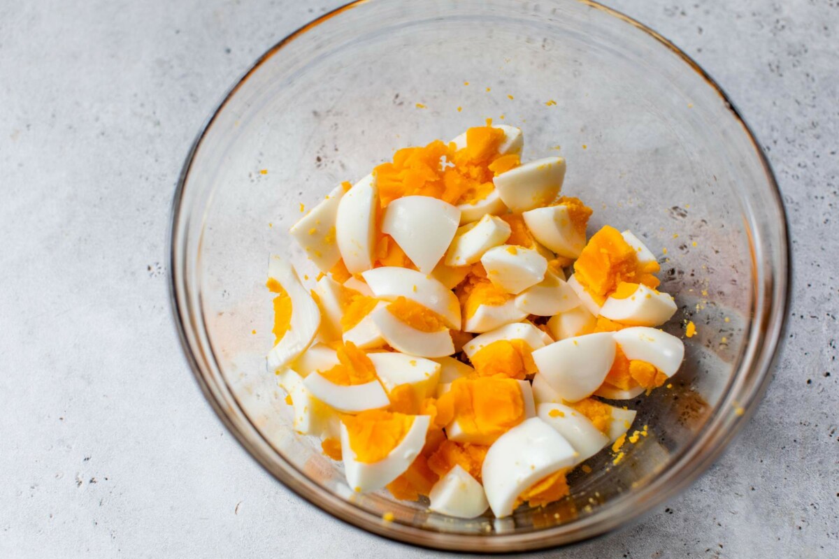 Chopped hard-boiled eggs in a large bowl.