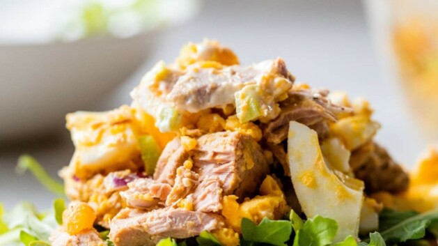 Egg Tuna Salad piled on a slice of bread with lettuce.