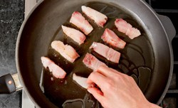 laying fish in saute pan