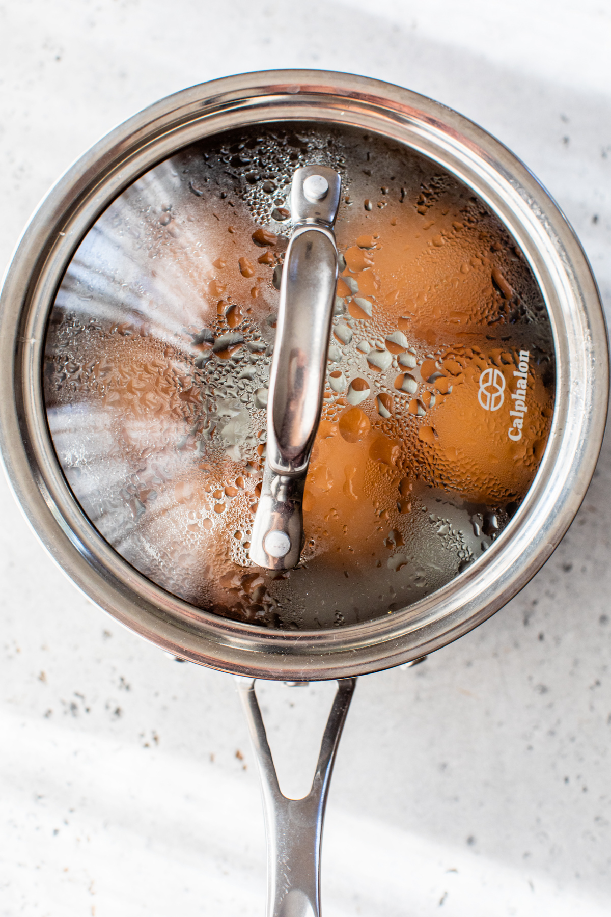 hard boiled eggs in a pot with a lid