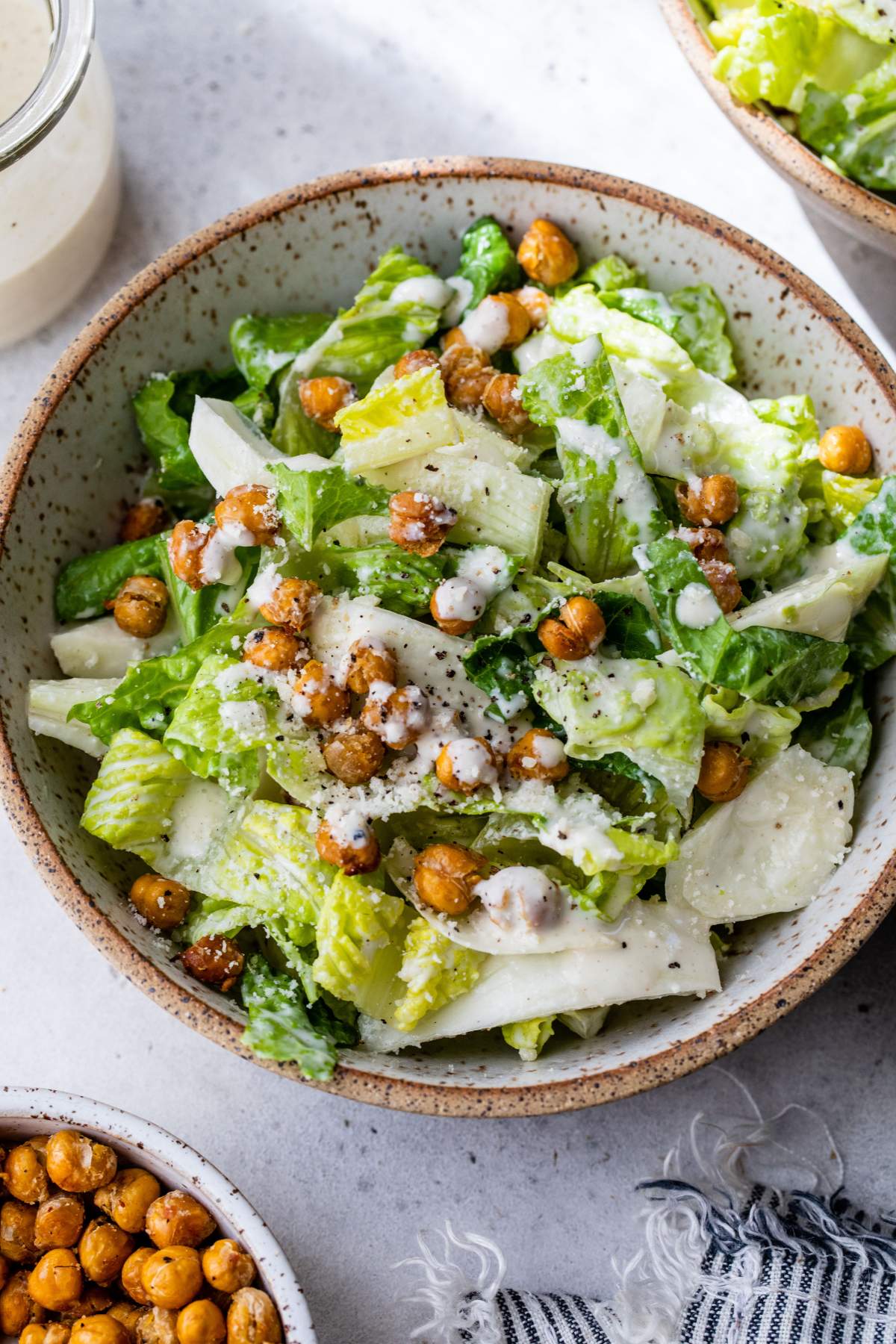 Healthy Caesar salad topped with roasted chickpeas.
