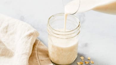 oat milk pouring into cup