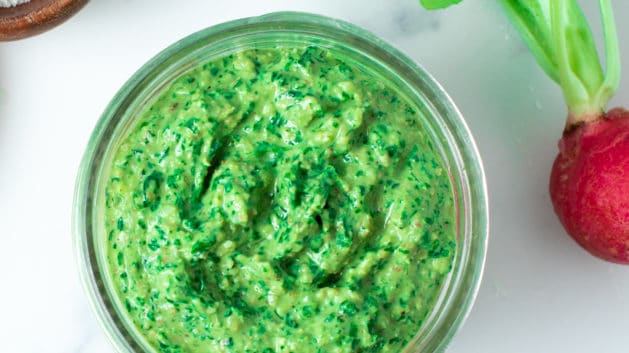 radish leaf pesto in a glass jar