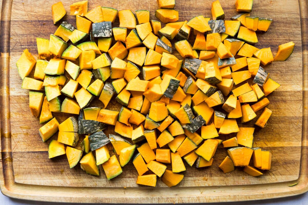 Cubed squash on a cutting board.