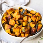 Roasted kabocha squash in a white bowl.