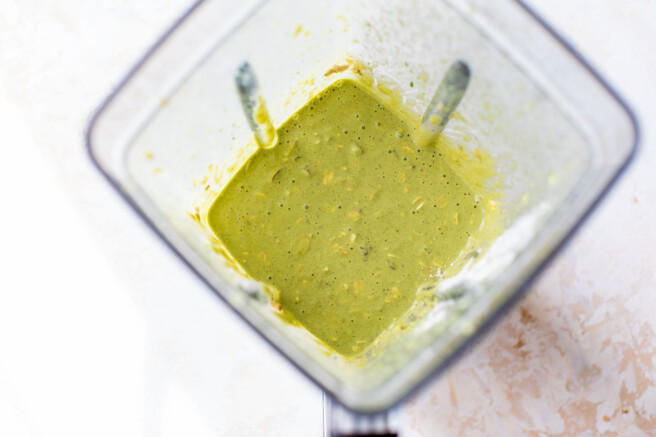 Spinach pancake batter with pats and walnuts mixed in