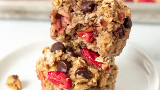 cherry oatmeal cups stacked on a white plate