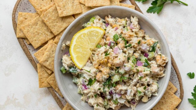 Tuna Chickpea Salad served with crackers and lemon slices.