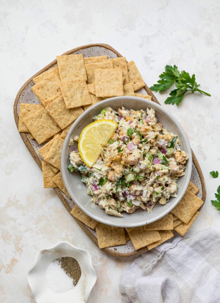 Tuna Chickpea Salad served with crackers and lemon slices.