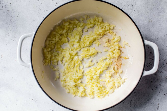 Sautéing onion in a pan.