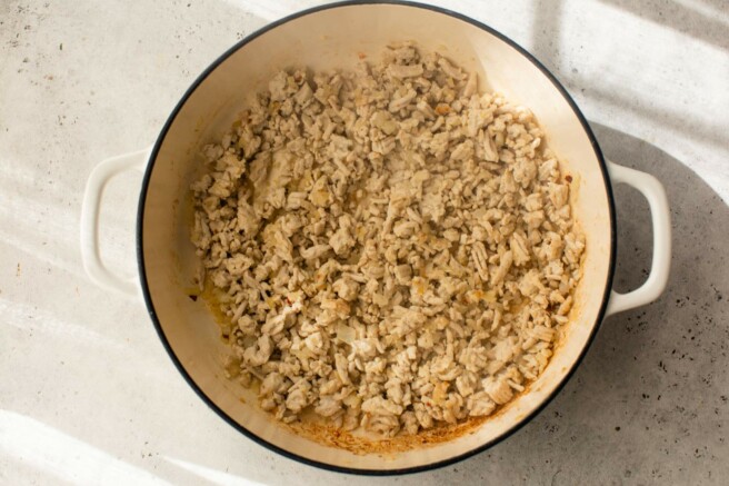 Ground turkey browned in a pot.