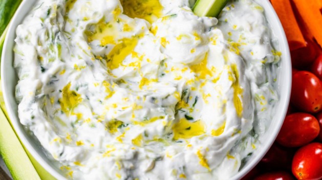 Tzatziki sauce served with fresh-cut veggies.