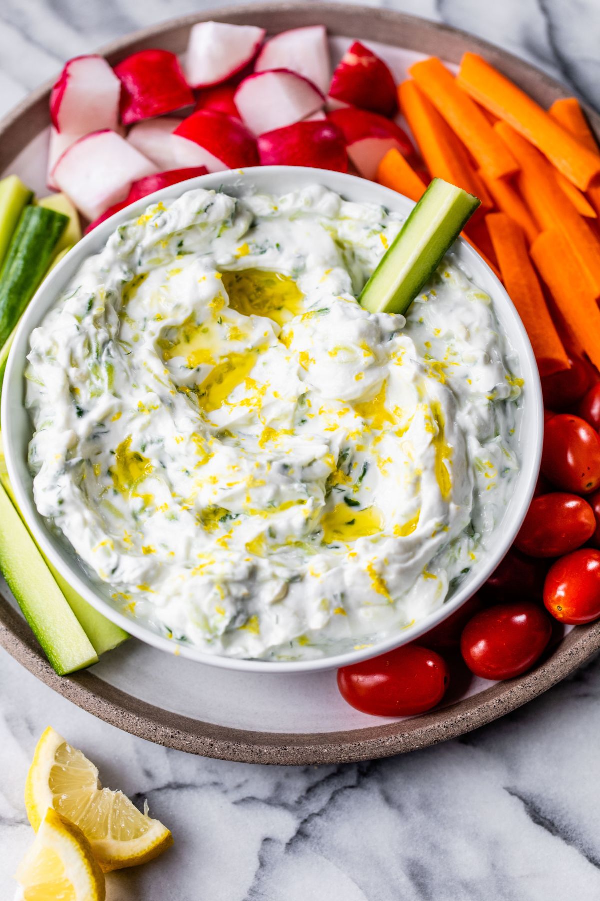 Tzatziki sauce served with fresh-cut veggies.